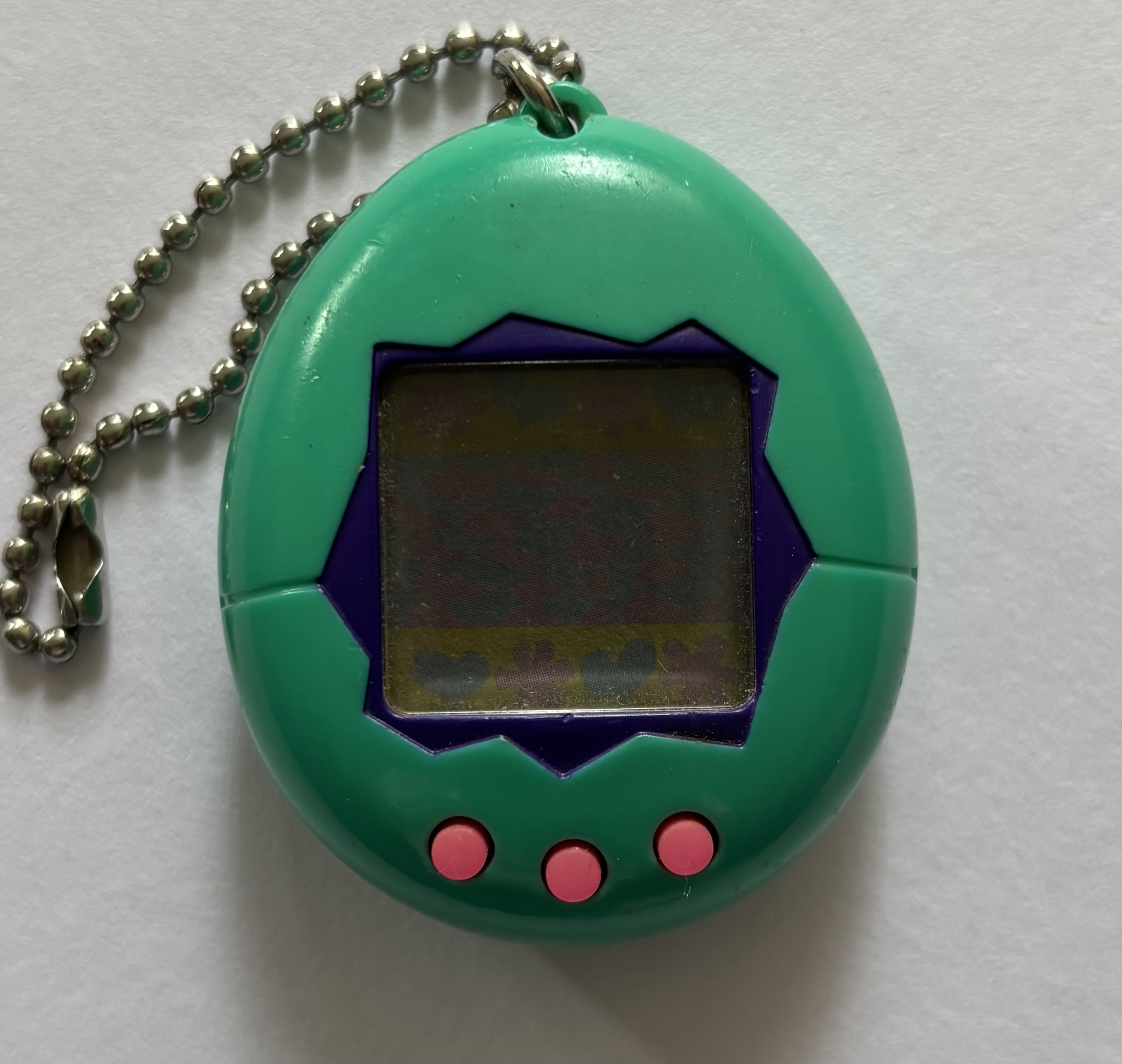 Dark blue green shell. Dark blue screen border. Hot pink buttons.